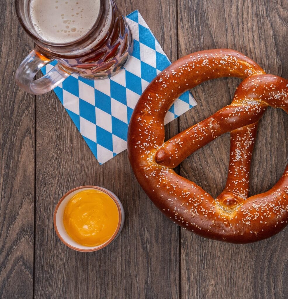 A Bavarian-style soft pretzel served with beer and mustard